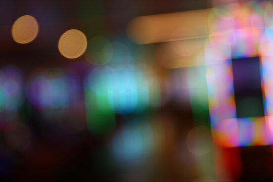 Abstract Blurred Casino Interior with Colorful Neon Lights and Bokeh Background