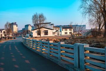 Fototapeta premium Hailong Lake Scenic Area in Meihekou – Ecological Wetland and Urban Park Landscape with Lakeside Recreation, Commercial Street and Public Leisure Spaces, China – April 2, 2026