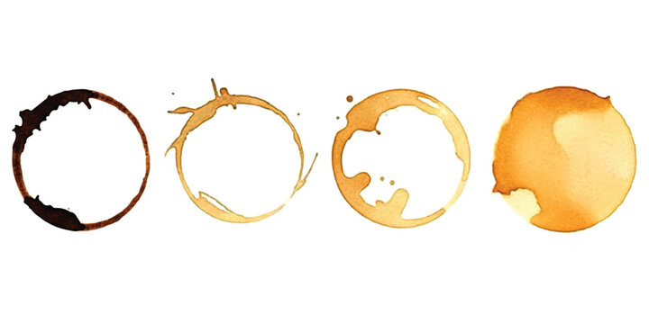 Set of four coffee cup stains and tea ring marks on a flat surface
