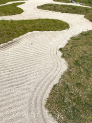 Naklejka premium Serenity path winds through green grass