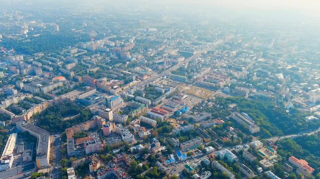 Kaluga, Russia. Sweeping aerial panorama over the Oka River and dense urban fabric, revealing a historic cityscape interwoven with broad green corridors under clear summer skies. Drone footage