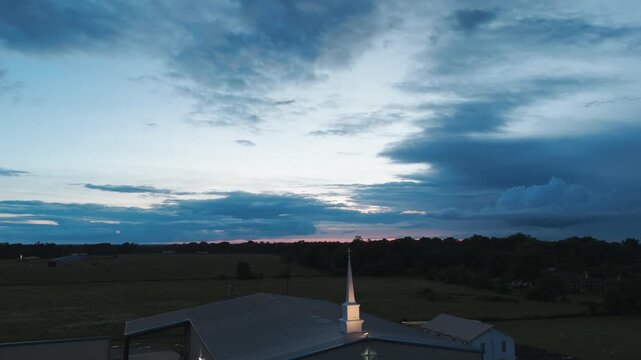 Sunset Sky Over Cornerstone Baptist Church In Gentry, Arkansas, United States. Aerial Wide Shot