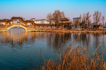 Obraz premium Hailong Lake Scenic Area in Meihekou – Ecological Wetland and Urban Park Landscape with Lakeside Recreation, Commercial Street and Public Leisure Spaces, China – April 2, 2026