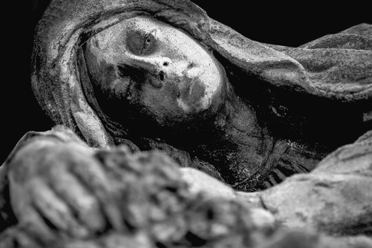 Grieving woman statue expressing sorrow pain and mourning after tragic loss