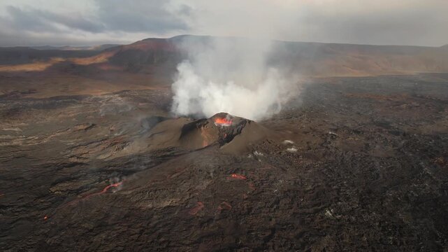 Aerial view of glowing lava erupting from an active icelandic crater