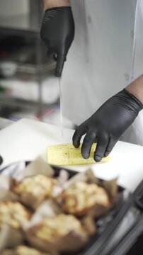 cutting a fresh pinneaple in the kitchen