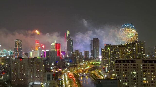 Ho Chi Minh City, Vietnam April 30, 2026 4k video of epic fire work performance to reunification Day of Vietnam at Sai Gon River look from the Gold view apartment, district 4 
