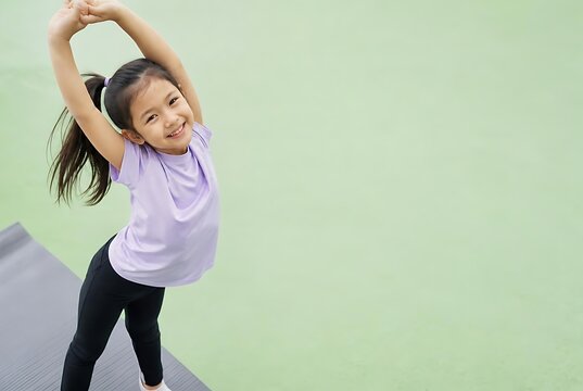 Young girl stretching body during active movement and exercise break