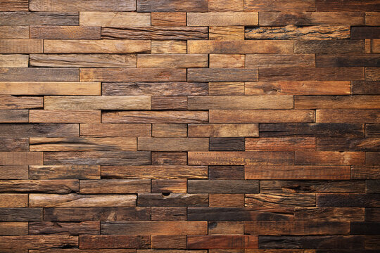 wood texture wall panel made of small planks. brown planks as background