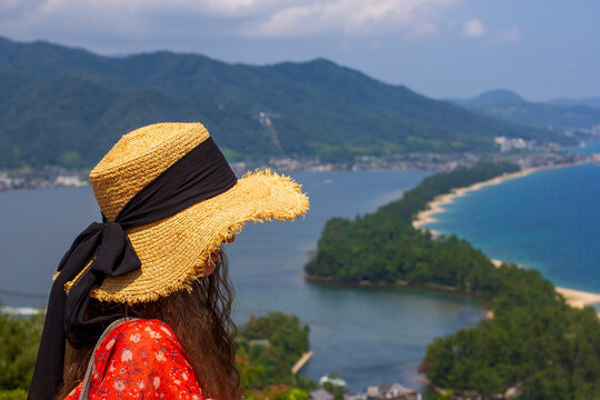 Amanohashidate, Kyoto Prefecture, Japan, Summer, Lady tourist in straw hat