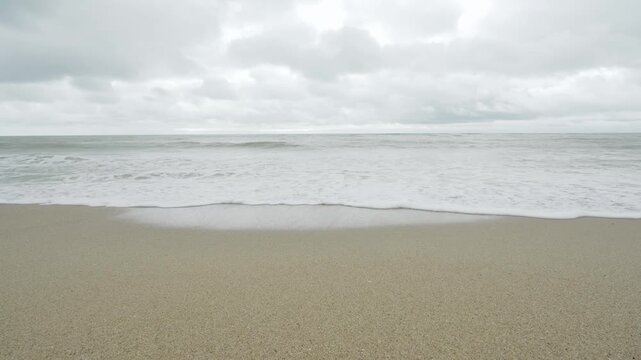 beach sea in cloudy day whilte rain and storm is coming, scary seashore scenic off Khaolak Phangnga beach  thailand with wave crashing on sandy shore Amazing travel and tour background Copy space