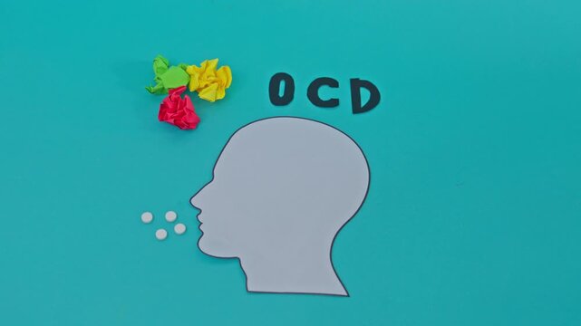 Stop Motion Animation Of Pills Moving Toward A Paper Head Silhouette With Ocd Text And Crumpled Paper