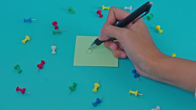 Hand Writing Acronym Ocd On Lime Green Sticky Note Surrounded By Scattered Colorful Push Pins On Blue Surface
