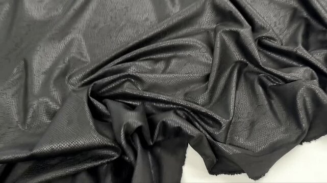 Premium onyx textile featuring an intricate snakeskin scales pattern with a subtle matte sheen and fluid drape ideal for edgy fashion apparel luxury accessories and modern interior design accents