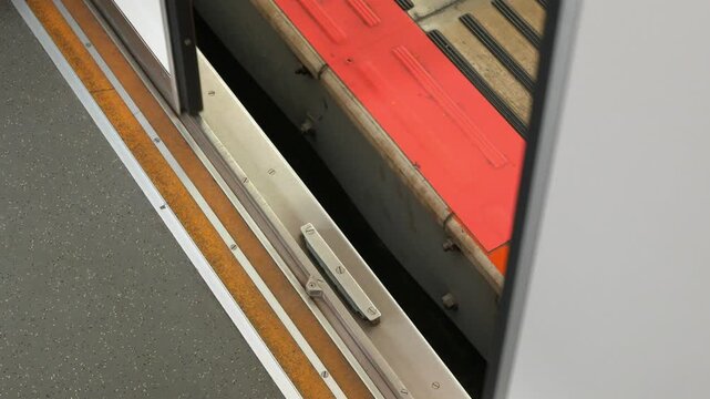 low angle view to skytrain subway door from inside the train commuter while train door open when arrive platform station.Japan train transportation in metopolis of Tokyo