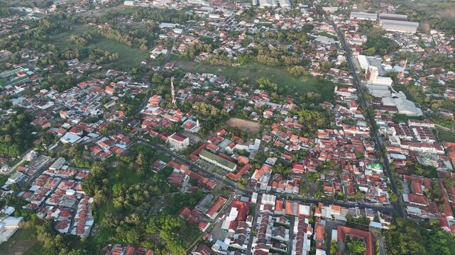 High Angle Aerial View of Densely Populated Residential Area with Red Roofs in Indonesia