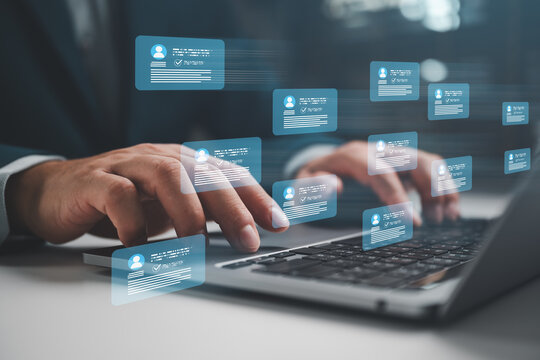 Businessman using laptop with digital customer data interface for social media marketing, audience engagement, online communication, CRM management and targeted business analytics.