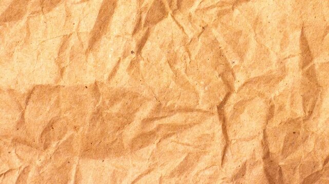 A close-up shot of a highly textured crumpled brown paper background