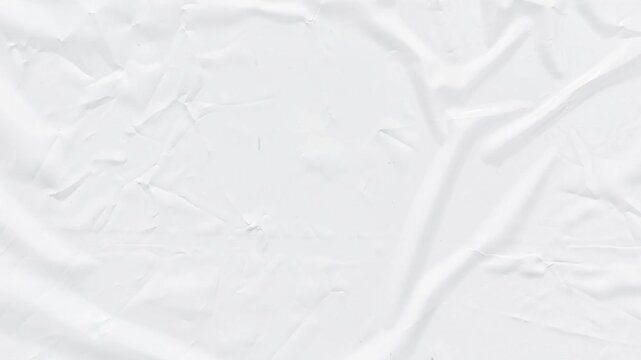 A close-up view of a textured white surface with crumpled patterns