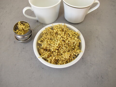 Dried elderflowers from the black elder bush, a tea egg and cups