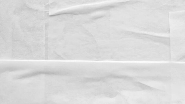 A person holds crumpled paper in a messy office environment.