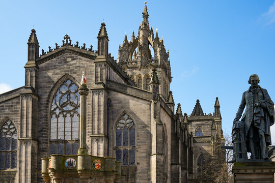 St. Giles&rsquo; Cathedral, a church building on the Royal Mile in Edinburgh. On the right is a bronze statue of the Scottish economist and philosopher Adam Smith