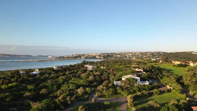 Drone view of luxury real estate properties at Goose Valley golf course on Keurbooms river estuary bank in Plettenberg Bay, Garden Route