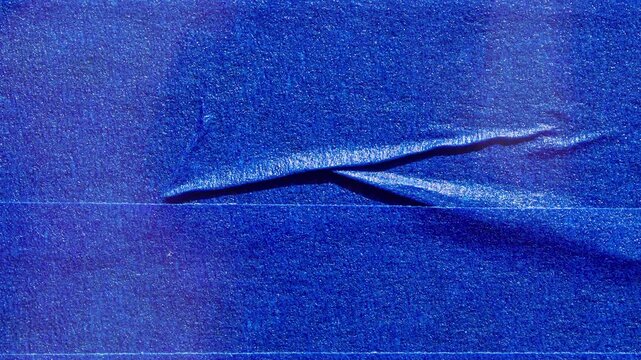 Blue Wrinkled Tape Texture Background With Torn Fold Detail Close Up