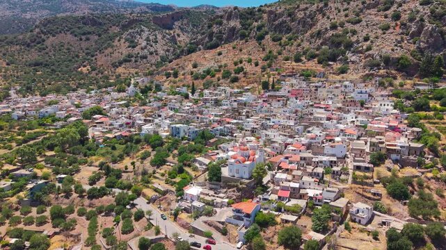 Aerial view of Kritsa village in Lasithi, Crete, featuring traditional white houses