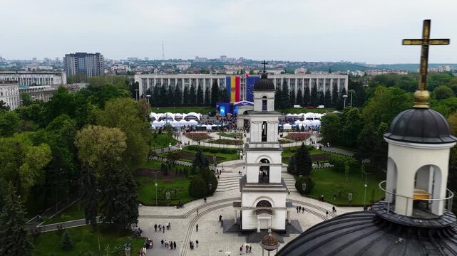 Orbit around cathedral cross and cinematic approach to Bell Tower in Chisinau center
