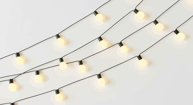string of fairy lights on black wire warm glow white background high quality professional