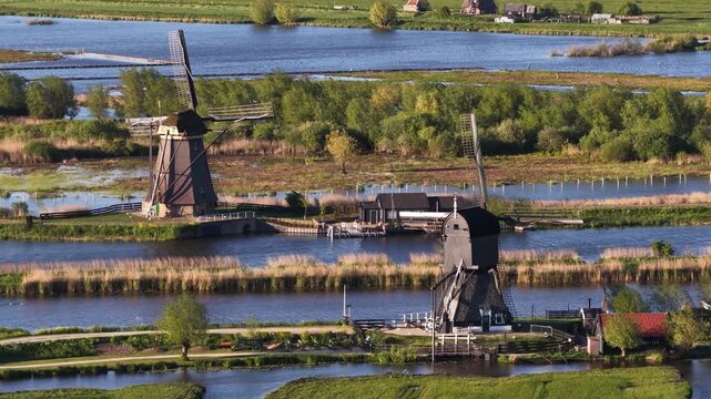 Dutch traditional windmills turning at kinderdijk