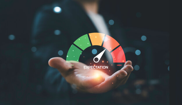 Business expectation and performance measurement concept with digital gauge indicator above hand, representing customer satisfaction, KPI evaluation, service quality and business performance analysis