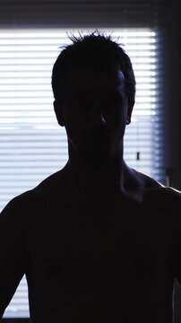Silhouette dumbbell biceps bodybuilding at home in slow motion
