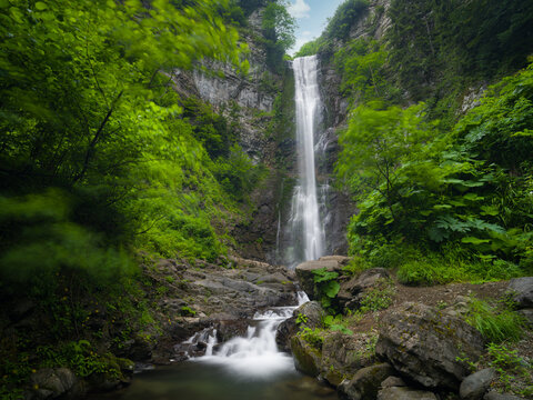 A hidden paradise waterfall in nature. A silky waterfall cascading from a height. Nature as the backdrop.