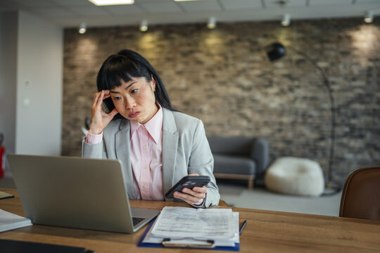 Businesswoman experiencing burnout and stress in office setting
