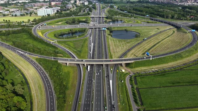 Aerial view of highway traffic and cloverleaf interchange