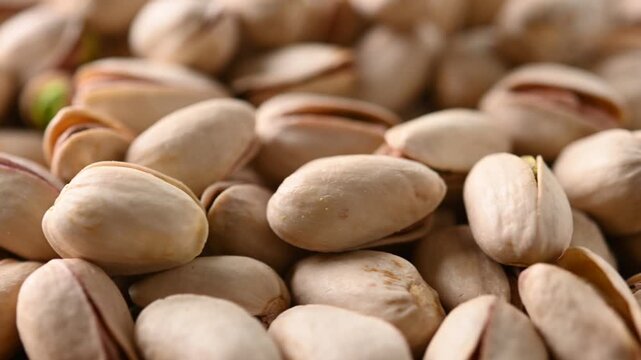 Rotating pistachio background close up texture video