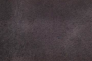 Fototapeta premium Close up of dark charcoal suede texture with natural surface structure for fashion background