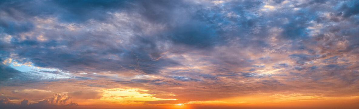 Panorama of a dramatic, tropical sunset sky as a background or texture