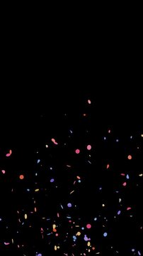 Colorful circle shape confetti burst both sides overlay on black background with alpha channel. 