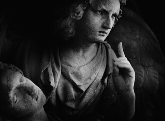 Naklejka premium Angel of death holding lifeless human body in dramatic monochrome style