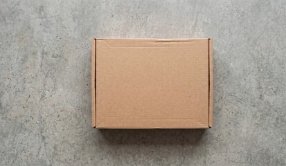 Fototapeta premium Blank brown corrugated cardboard mailer box mockup flat lay