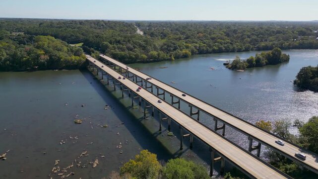 J R Allen Bridge US 80 crosses Chattahoochee River linking Columbus Georgia and Phenix City Alabama along Fall Line Freeway future I14 corridor marking Piedmont to Coastal Plain transition, pullback