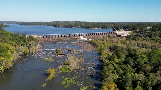 Oliver Dam on Chattahoochee River between Columbus Georgia and Phenix City Alabama built 1959 by Georgia Power forms Lake Oliver with spillway and bedrock shoals downstream under regulated flow static
