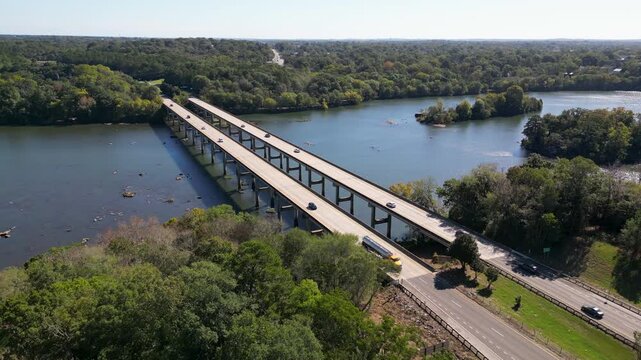 J R Allen Bridge US 80 crosses Chattahoochee River linking Columbus Georgia and Phenix City Alabama along Fall Line Freeway future I14 corridor marking Piedmont to Coastal Plain transition, drone push