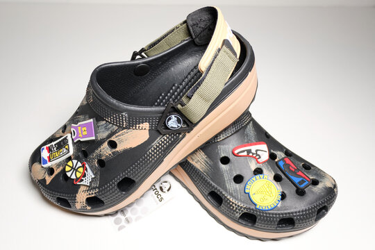 kent, uk, 01.01.2026 Crocs Classic Hiker Clog with basketball themed charms and rugged platform sole isolated on white studio background. Trendy fashionable footwear
