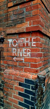 To the River Chalk Sign on Brick Wall in Cambridge City Centre