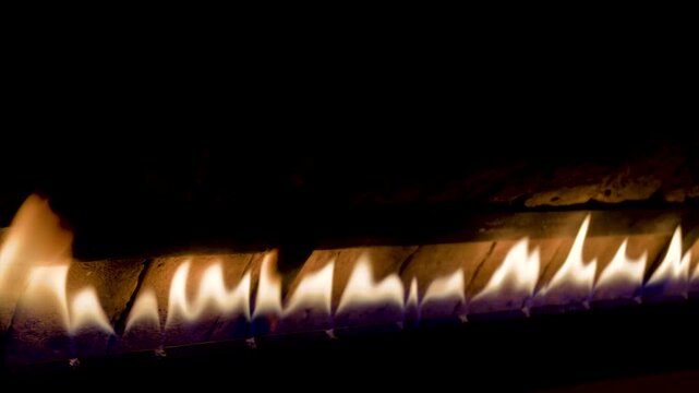 Turkish traditional oven. Fire in the wooden oven. Firewood is burning in the oven, preparation for baking bread.