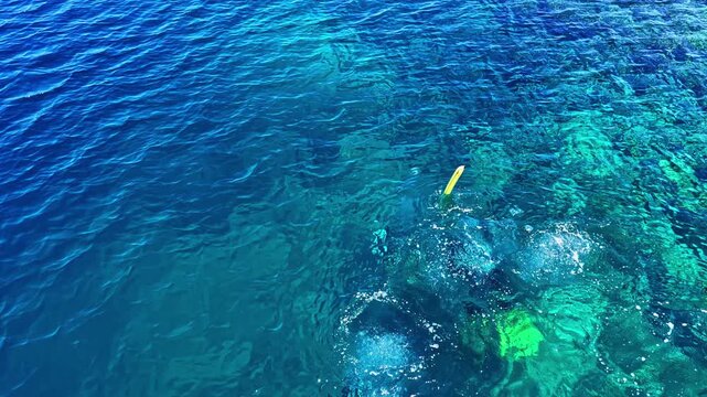 Snorkeling adventure captured from above in Port Barton Beach